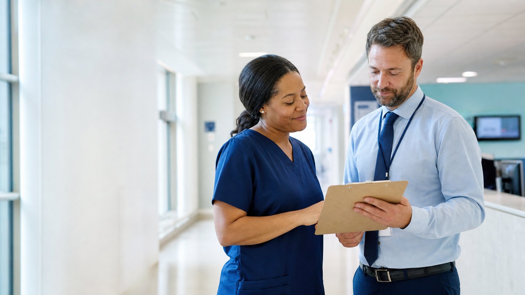 A clinician and facility leader completing a shift handoff